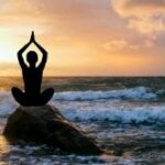 Person Meditating on the Beach